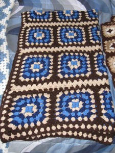 Crocheted Afghans I  made of Granny squares in brown, tan, and blue